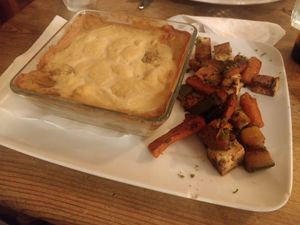 Gratin dauphinois with vegetables of the day and grilled tofu (main dish, 18 €). at The Judgy Vegan in Brussels