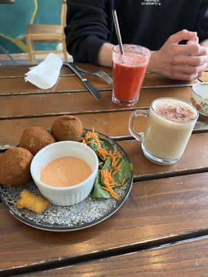 Arranchinis and cappuccino   at The Judgy Vegan in Brussels