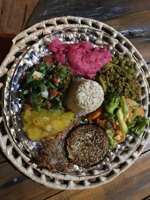Dinner is served: homemade potato-beetroot mash, curry lentils, coconut-milk veggies, fried eggplant in sesame, potato-carrot hash browns with mango chutney, a mixed spinach-rocket salad and brown rice.  at Coco-Knots Kite Lodge in Itarema