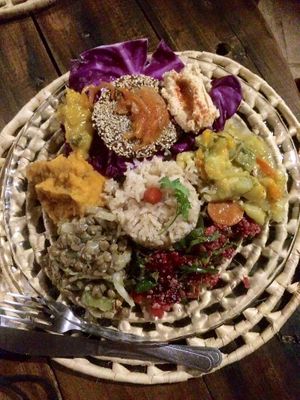 Homemade veggie patty in a sesame-coat, a roasted onion topping and mango chutney + humus aside, potato-carrot mash, tasty veggie-lentils mix, rocket-beetroot salad with quinoa, veggie mix with spicy coconut-milk and brown rice.  at Coco-Knots Kite Lodge in Itarema