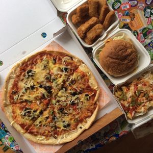 Veggie supreme, nuggets, loaded fries, and smoked tempeh burger.  at Zad's in Manchester