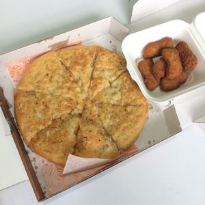 9" garlic bread, and nuggets. at Zad's in Manchester