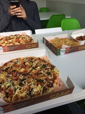 'Pig Save' Pizza top left,  garlic bread and nuggets, and Veggie Supreme pizza (olives swapped for spinach). at Zad's in Manchester