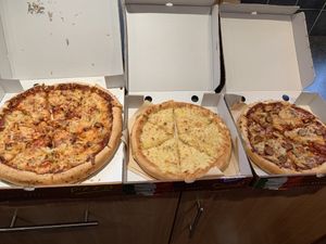 12” Hawaiian plain crust, 9” complimentary “cheese” and garlic bread, and 9” pig save plain crust at Zad's in Manchester