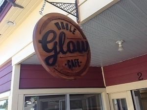 sign outside at Whole Glow Cafe in Cumberland