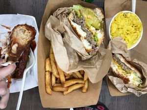 Bbq wings, original impossible burgers with fries and Mac and cheese.  at Marty's V Burger in New York City