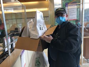 Marty making donated meal delivery. at Marty's V Burger in New York City