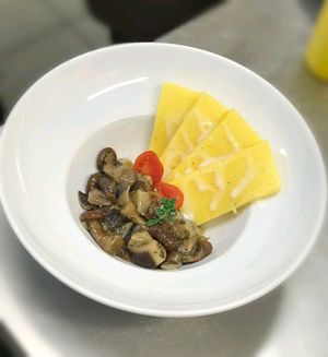 Polenta con funghi  at Universo Vegano in Verona