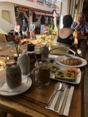 Brekkie: chia pudding, avo toast and ice latte with almond milk❤️ (friend had croissant (vegetarian), pudding and black coffee) at Aroma Isla in Isla Mujeres