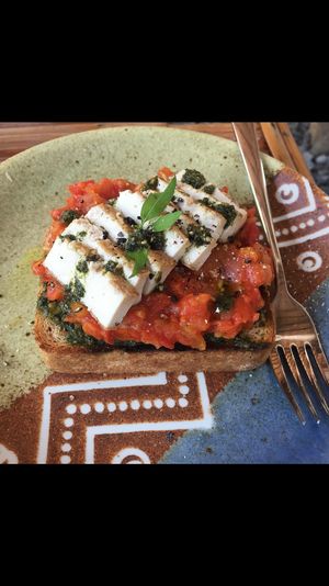 Pizza toast with fermented pesto, tofu cheese, and homemade tomato sauce  at Uguisu Sabou in Kampot