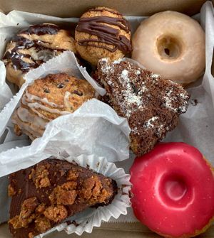 Choc. Chip Bundt cake, coconut macaroon, maple donut, lemon berry scone, raspberry coffee cake, PB Cookie Monster cake, raspberry donut! at Sweet Alchemy Bakery and Cafe in Essex Junction