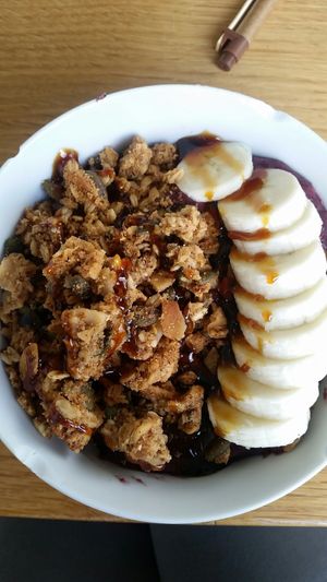 Acai bowl with coconut syrup on top yum yum at Glory Juice - Olympic Village in Vancouver