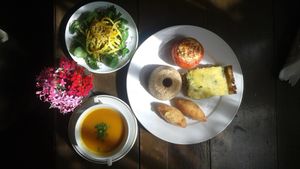 Brown rice, stuffed tomatos, brocoli pie (gluten free), aipim balls, Pumpkin broth and organic salad! at Nacasadela in Penedo