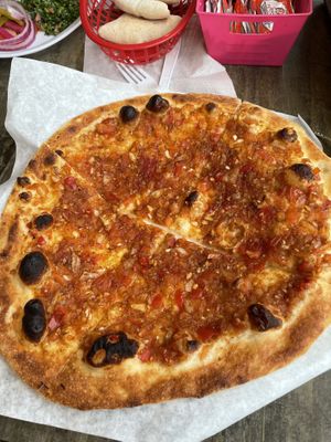 Vegan “pizza” with peppers and onions   at Pita Restaurant in Rochester