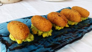 QUINOA AND DRY TOMATO CROQUETTES
with avocado and corn
 at Passio Mediterrania in Mahon
