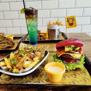 Freedom Burger with poutine fries and our V Passion cocktail. at Got No Beef in Cardiff