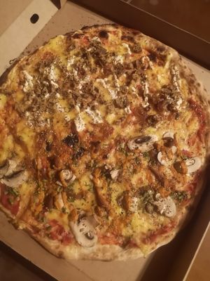 Half serán-mustard, half romescu pizza at Pizzeria Trozo in Bilbao