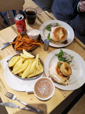 Delicious lunch of 'chicken' and 'rib' burgers with sweet potato and regular fries at No 18 Cafe in Swansea
