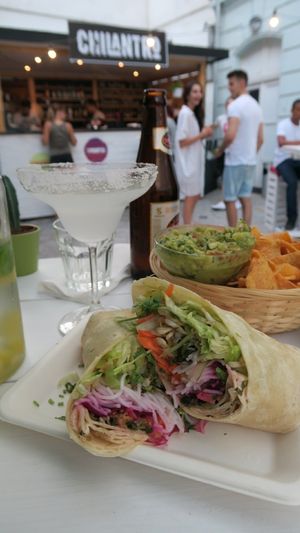 Guacamole with nachos and asian fusion burrito. at Chilantro Garden Bar in Bratislava