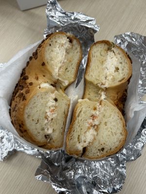 Toasted onion bagel with veggie vegan cream cheese  at Bare Naked Bakery & Cafe in Plainview