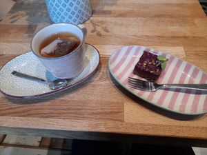 Blue berry and raspberry rawcake, rooibos tea. at Kaffila in Tampere