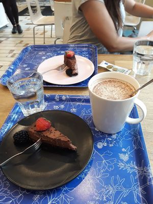 Raw vegan chocolate cake and a vegan chai latte at Kaffila in Tampere