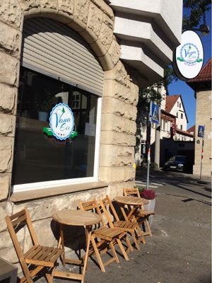 Wooden tables in front of ice cream parlor  at Vana Eis - Die Manufaktur in Fellbach
