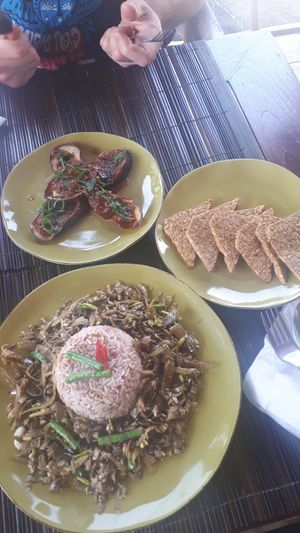 Aubergine in tomato ginger sauce, tempe, stir fried banana flowers and red rice at Catur'z Coffee Club in 