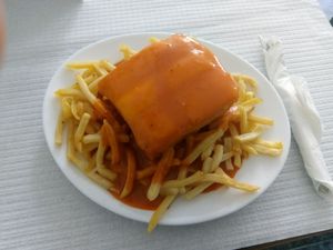 Typical Portuguese Sandwich on a Vegan Version. The famous Francezinha. Best informações Oporto City. at Pecado Saudável in Porto