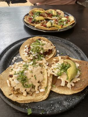 Al pastor tacos (background), chorizo roja taco, milanesa taco, and seitan al chimmichuri taco (all with added queso)  at Por Siempre Vegana Vol II in Mexico City