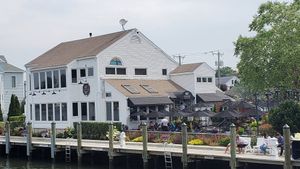 view of restaurant from bridge at S&P Oyster Company in Mystic
