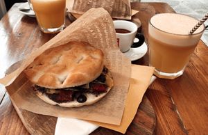 Focaccia with dried tomatoes, red pepper, black olives, zucchini & olivepate, Espresso and fresh Melon Juice  at Lunch Box in Vernazza