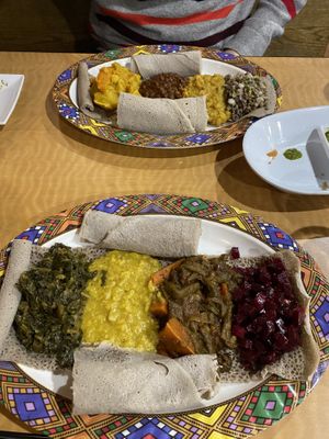Both plates completely vegan, a mix of lentil dishes and vegetables!  at Goorsha in Durham