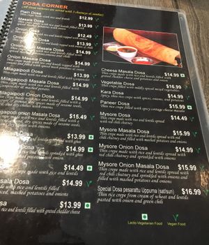 One page of the multi-page menu: notice how most of the items (18 on this page alone) are vegan (marked with green V) at Saravana Bhavan in New York City