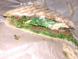 Panini - cashew cheese, tomato, spinach, v pesto at Waveriders Coffee & Deli in Nags Head