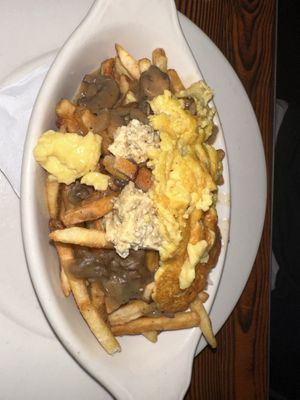 Vegan Poutine w/ house tofu "feta" and mushroom gravy   at Oak  in Seattle