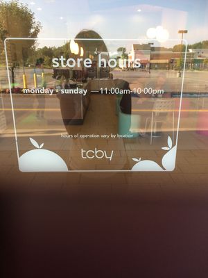 store hours on window at TCBY in Victor