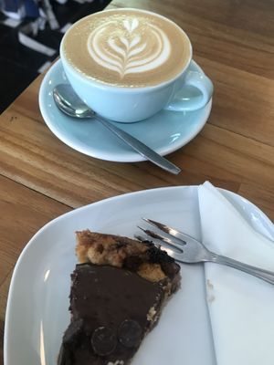 Cropped due to already having started the cake... flat white art 😃 at Vero Caffe in Bruges