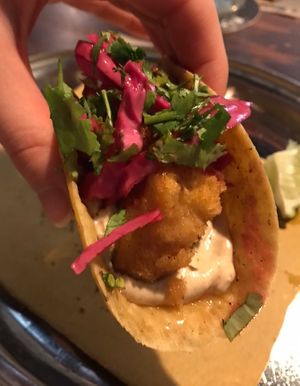 FRIED TOFU TACO with also pickled purple cabbage, chipotle sauce, coriander and lime juice  at Urban Farmhouse in Pordenone