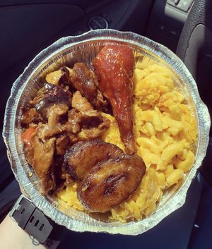 Medium meal with ginger chicken, bbq drumsticks, and double Mac n cheese at Veggie Castle in Jamaica