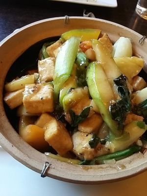 Nr 39- Stir-fried organic tofu with fresh vegetables, oyster mushrooms, lemongrass, sesame seeds and sweet basil in a clay pot. Gorgeous. at Bun Bo Hue in Stockholm