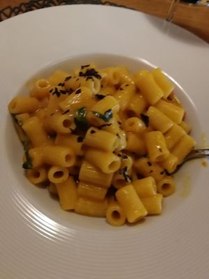 Blurrred photo of noodles with tomato sauce at Posta Zirm Hotel in Corvara In Badia