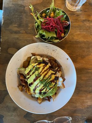 Hash with avocado main and poached egg  at Chickpea Restaurant in Vancouver