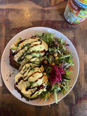 Fritters with avocado main and poached egg  at Chickpea Restaurant in Vancouver