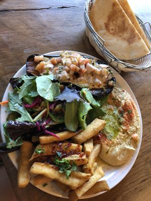 Platter with roasted eggplant. at Chickpea Restaurant in Vancouver