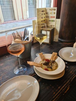 Truffle hummus with olives and tomatoes at La Bartola in Sevilla