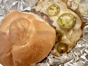 Impossible Burger with onion, jalapeños, and Swill sauce (Vegan)  at The Playhouse & Swillburger in Rochester