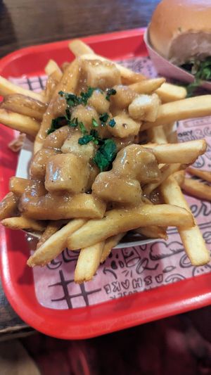 poutine fries with vegan tofu curds at The Playhouse & Swillburger in Rochester