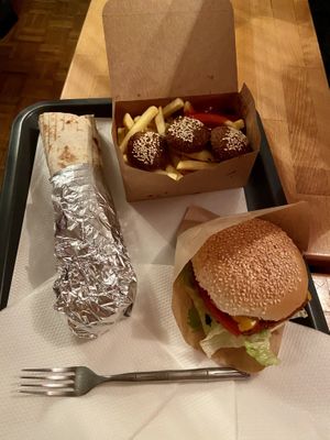 vegan cheeseburger, vegan chicken wrap and falafel wrap at Fari's in Ljubljana