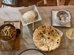 Raita. Rice. Aloo naan and jalfrezi   at Spice Garden in Sitges